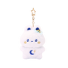 Miniz Bunniroll Starlight Collection plush charm keychain — soft white bunny with moon and star embroidery, gold star hair bow, and gold star-shaped clip