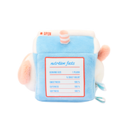 ide of milk carton plush with printed nutrition facts: sweetness, cuteness, and softness 100%