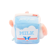 Left side of Anirollz milk carton plush with “MILK” label, cartoon cow, and red stripes