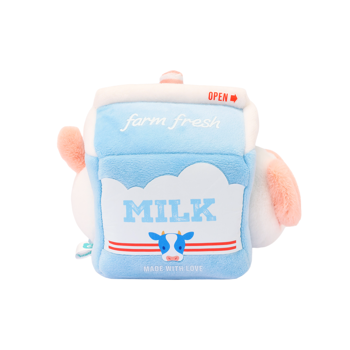 Left side of Anirollz milk carton plush with “MILK” label, cartoon cow, and red stripes