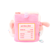 Side of strawberry milk carton plush with printed nutrition facts: sweetness, cuteness, and softness 100%