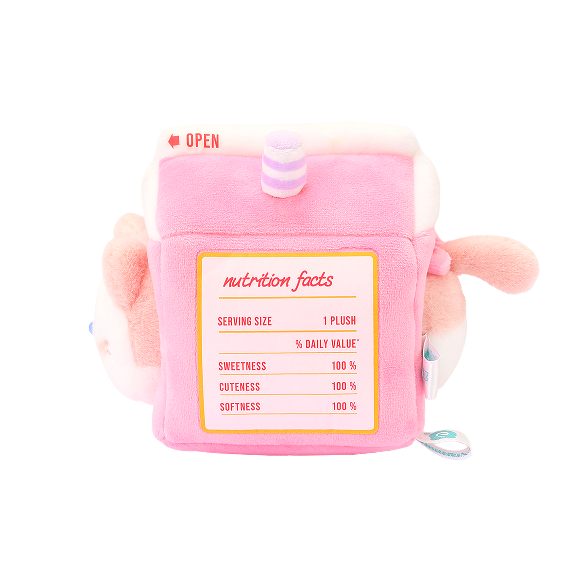 Side of strawberry milk carton plush with printed nutrition facts: sweetness, cuteness, and softness 100%