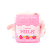 Left side of Anirollz pink strawberry milk carton plush with “MILK” label and three printed strawberries